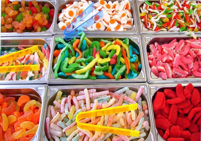 A selection of diverse candies arranged in trays