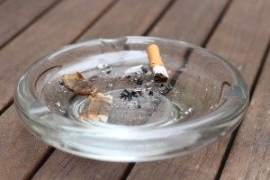 Ash tray placed on a wooden table