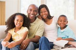 a family of four smiling